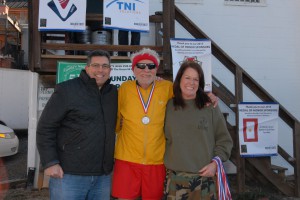 Ken Falke and Laurie Enright award a medal to the fastest male in the Over 80 age group!