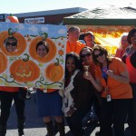 From left to right:  Patricia and Laura in the pumpkin painting,  Justin in orange in the back row,  and Lisa holding the trophies