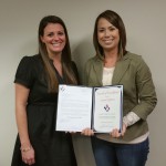 Megan Shelton (left) recognized Lauren Hoffman  for her commitment to excellence.