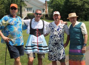 The tent sporting the challenge “Dress Like a Lady or Hit Like a Pro” is a favorite among golfers! 