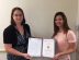 Team Lead, Dawn Petruzzello (right), awards Kati Weaver.