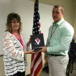 Patti Rice presents Award of  Excellence to Justin O’Neill