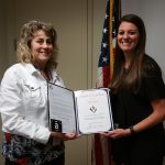 VMSI PM, Megan Shelton, presents an award to Patti Rice
