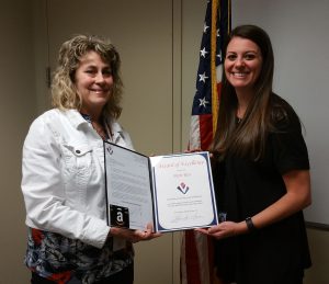 VMSI PM, Megan Shelton, presents an award to Patti Rice