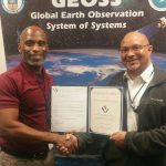 Charles Curtiss (left) received an Award of Excellence from Team Lead, Charles Owens.