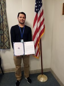 Parwaiz Ahmadzai presented with an Award of Excellence.