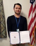 Parwaiz Ahmadzai presented with an  Award of Excellence.