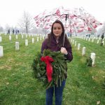 VMSI Program Manager,  Emily Wilson, laying wreaths