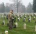 A soldier laying wreaths