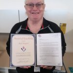 Rick Burgard receives an Award of Excellence for contract closeout support.