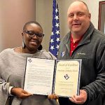 Mariama being presented with her  Award of Excellence by VMSI’s Ken Konkol.