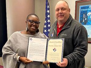 Mariama being presented with her  Award of Excellence by VMSI’s Ken Konkol.